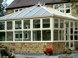 uPVC Edwardian style conservatory with sash windows, cresting and finials